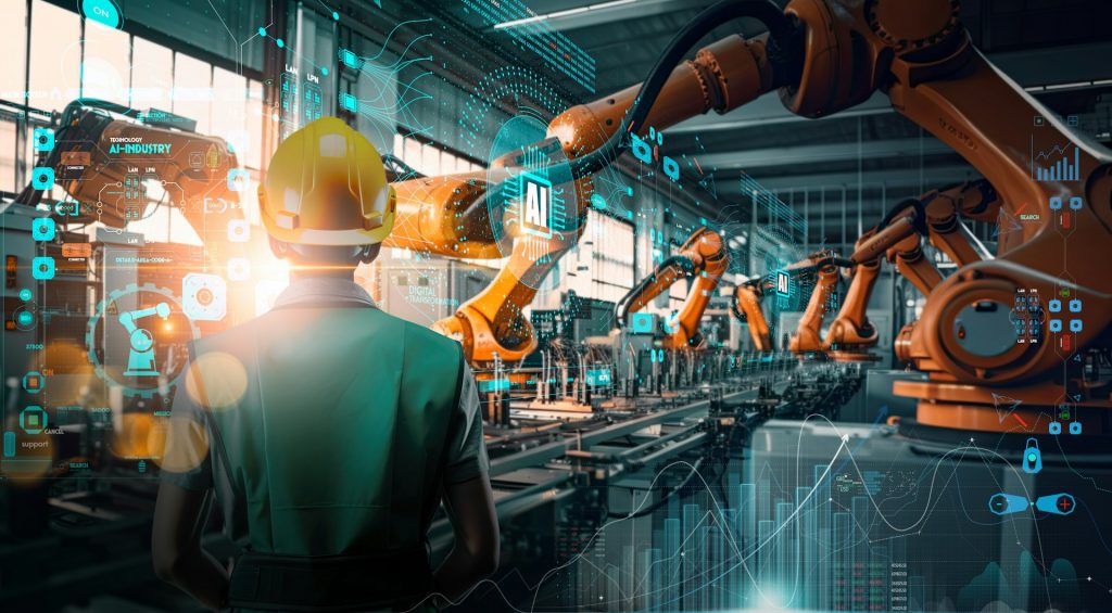 Robots4CleanTech: Industrieumgebung mit automatisierten Roboterarmen und integrierter KI-Datenanalyse, während eine Fachkraft den digital gesteuerten Produktionsprozess überwacht.